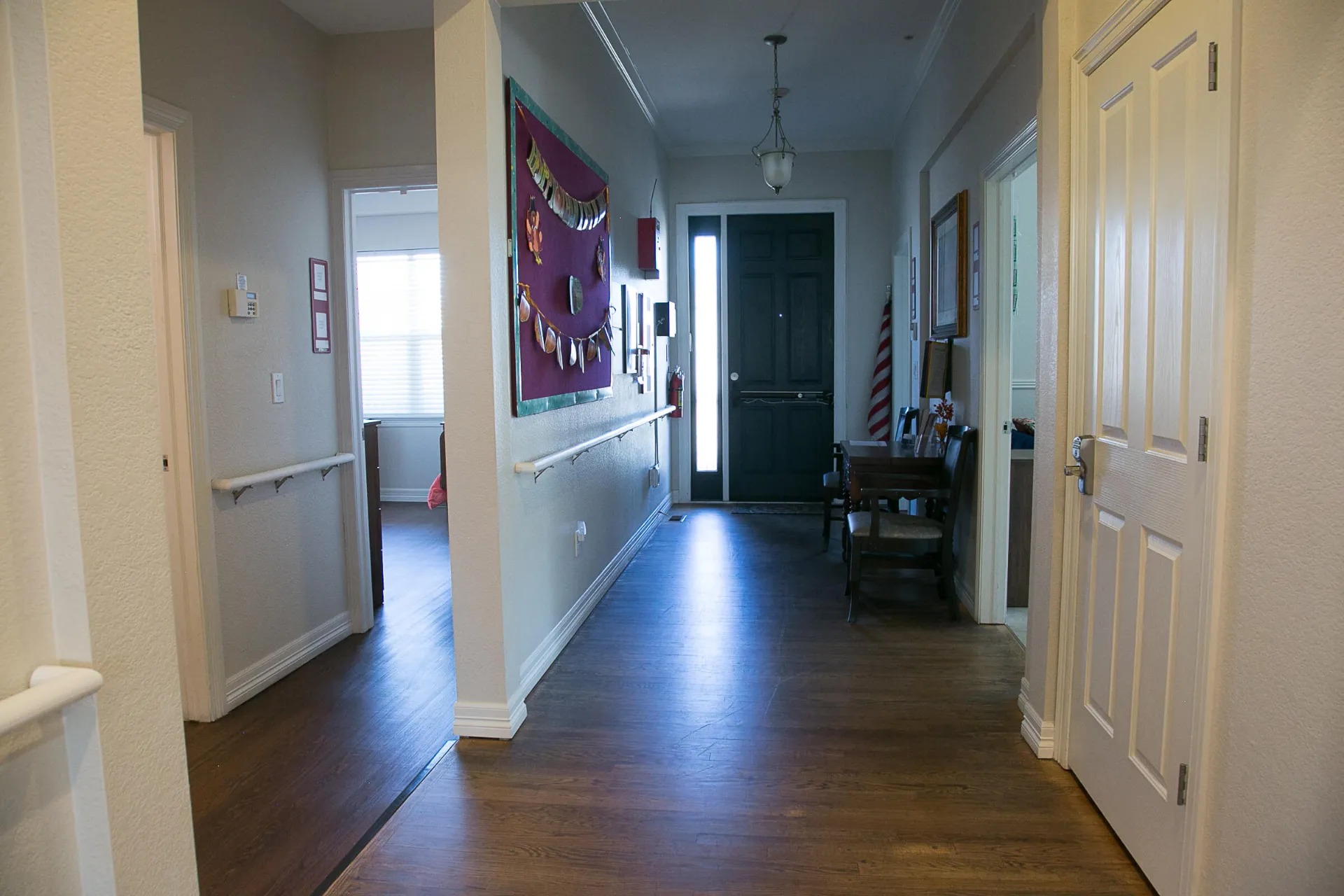 Our hallway with an assistive rail along the the wall.